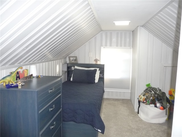 bedroom with carpet flooring and vaulted ceiling