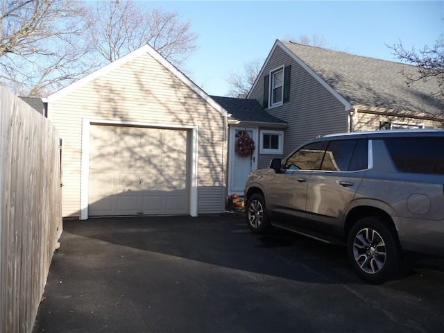 view of property exterior with a garage