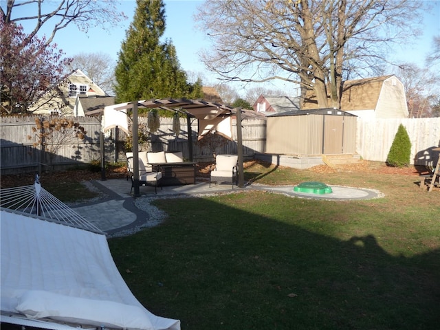 view of yard with a patio area and a storage shed