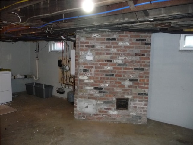 basement featuring washer / clothes dryer and a wealth of natural light