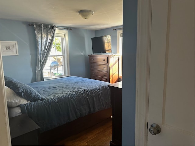 bedroom with hardwood / wood-style floors