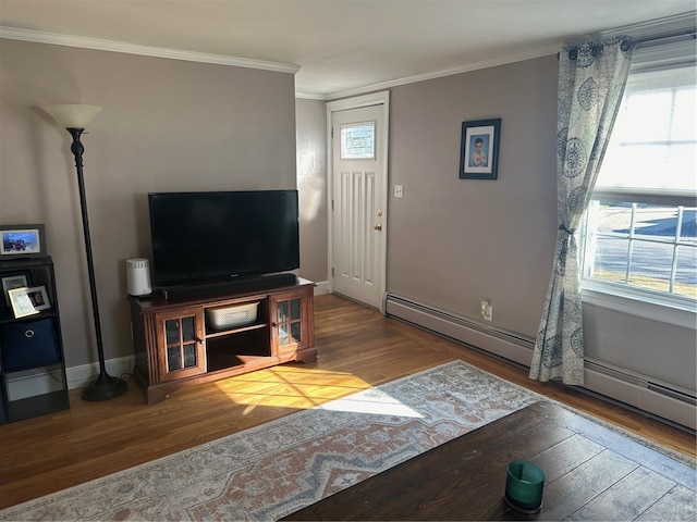 living room with hardwood / wood-style flooring, plenty of natural light, and ornamental molding