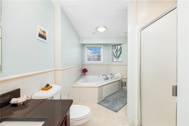 full bathroom featuring tile patterned floors, vanity, separate shower and tub, and toilet