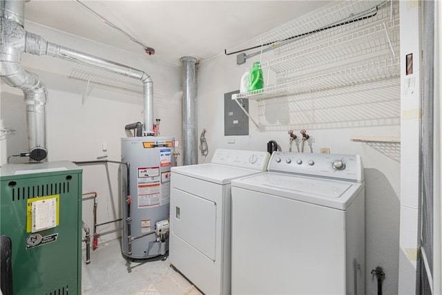 clothes washing area featuring electric panel, gas water heater, and washer and clothes dryer