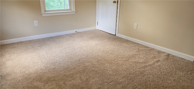 unfurnished room with carpet floors