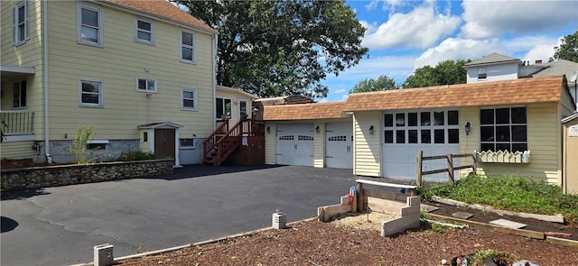 view of side of home featuring a garage