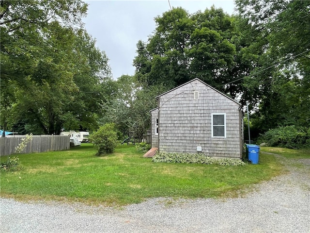 view of side of property featuring a lawn