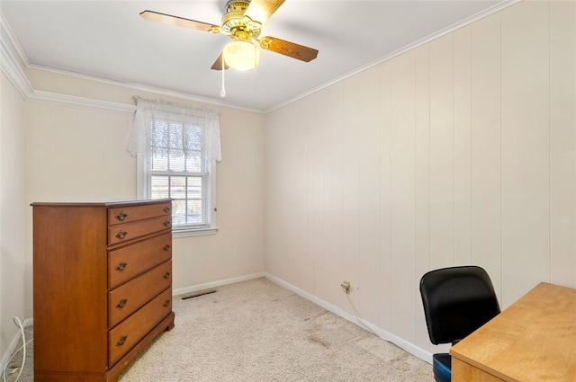 carpeted office with ceiling fan and ornamental molding