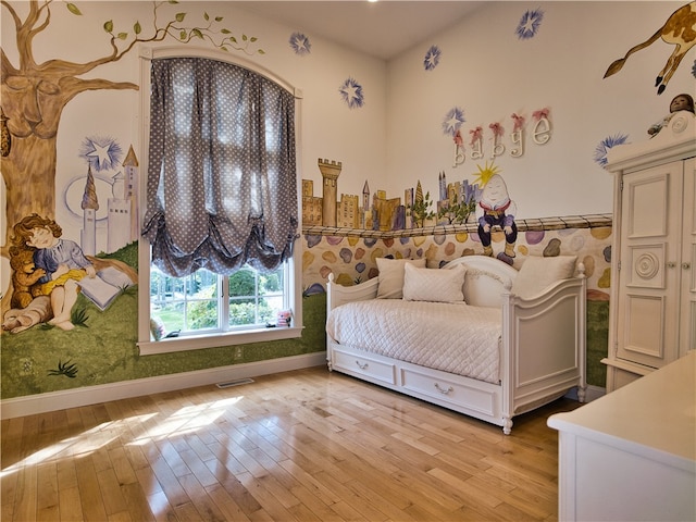 unfurnished bedroom with light wood-type flooring