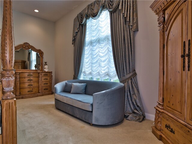 living area with light carpet