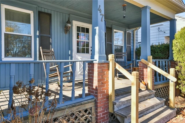 wooden deck featuring covered porch