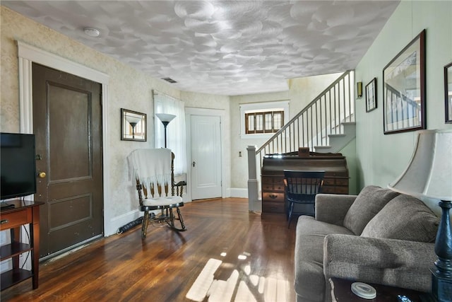 living room featuring dark wood-type flooring