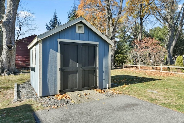 view of outdoor structure with a lawn