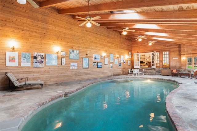 view of pool with ceiling fan and a skylight