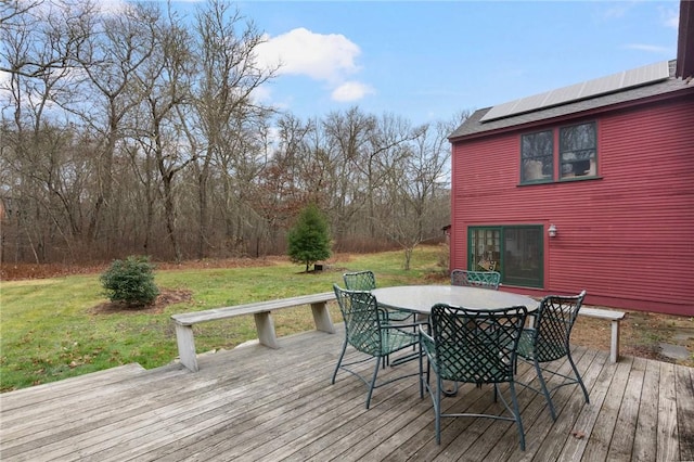 wooden deck with a yard