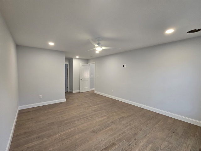 unfurnished room featuring dark hardwood / wood-style flooring and ceiling fan