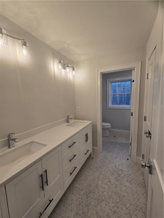 bathroom with vanity and toilet