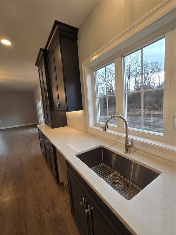 kitchen with dark wood-type flooring and sink