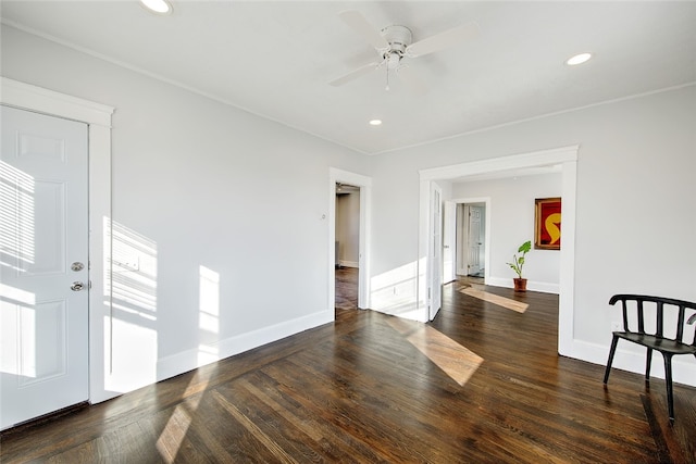 spare room featuring dark hardwood / wood-style floors and ceiling fan