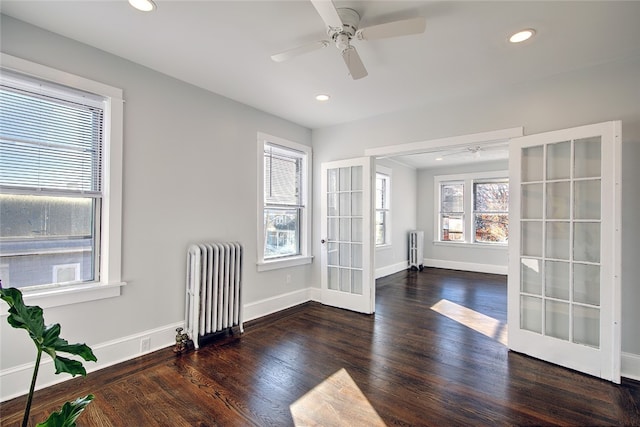 interior space featuring radiator heating unit, dark hardwood / wood-style floors, and french doors