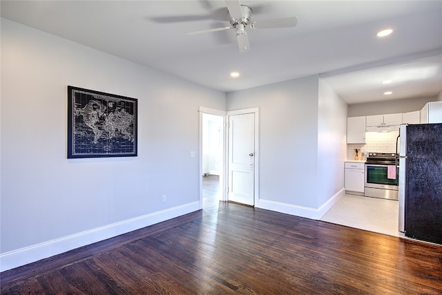 unfurnished living room featuring hardwood / wood-style floors and ceiling fan