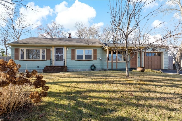 ranch-style home with a front yard and a garage