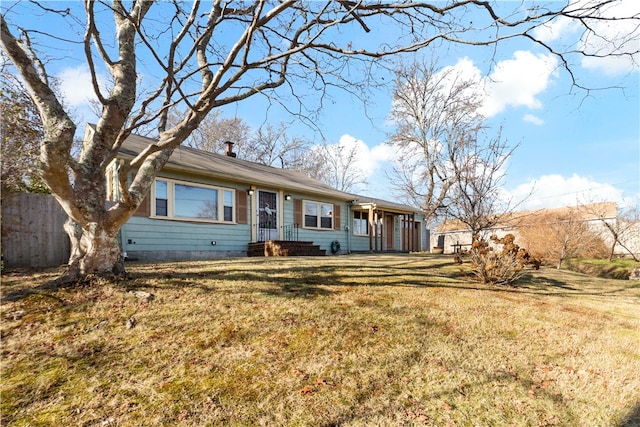 ranch-style house featuring a front lawn