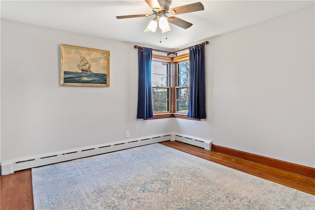 unfurnished room with wood-type flooring, baseboard heating, and ceiling fan