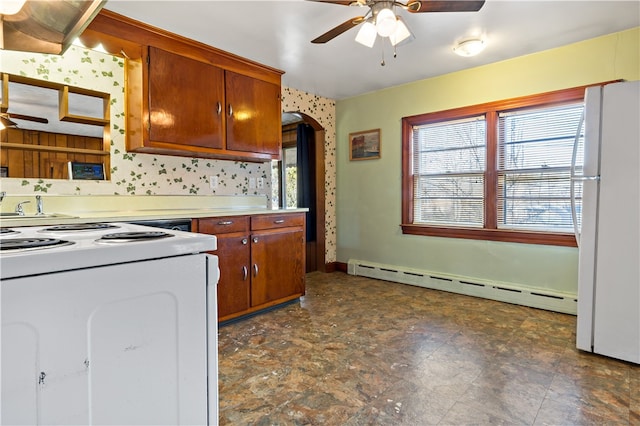 kitchen with white appliances, ceiling fan, and a baseboard heating unit