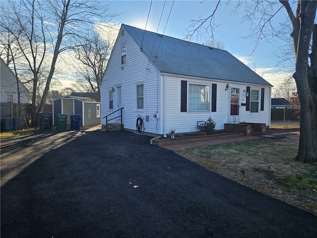 view of front of house with a storage unit