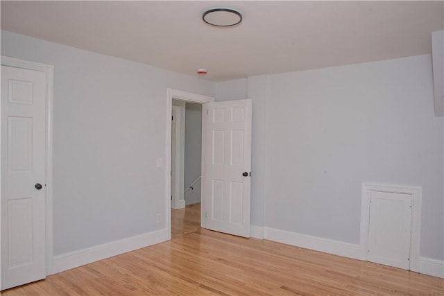 spare room featuring light wood-type flooring