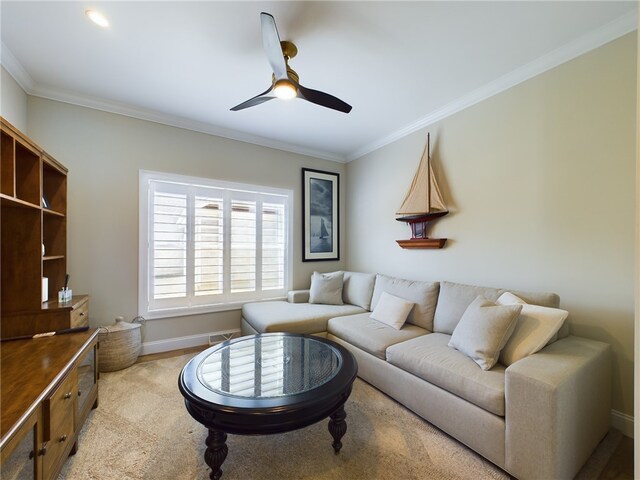 carpeted living room featuring ceiling fan and crown molding