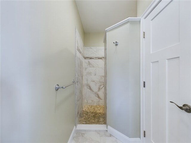 bathroom with a tile shower