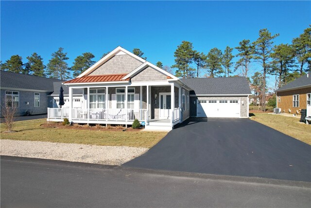 view of front of home featuring a garage and covered porch