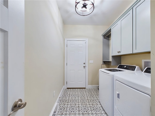 washroom with cabinets, light tile patterned floors, and separate washer and dryer