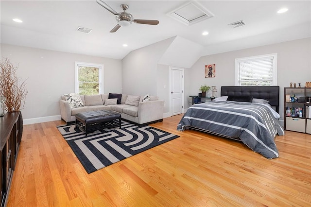 bedroom with hardwood / wood-style flooring, ceiling fan, and lofted ceiling