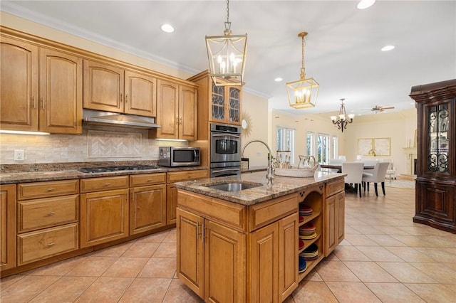 kitchen with ceiling fan, stainless steel appliances, dark stone countertops, pendant lighting, and light tile patterned floors