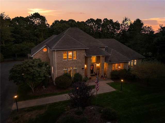 view of front of home featuring a patio area and a yard