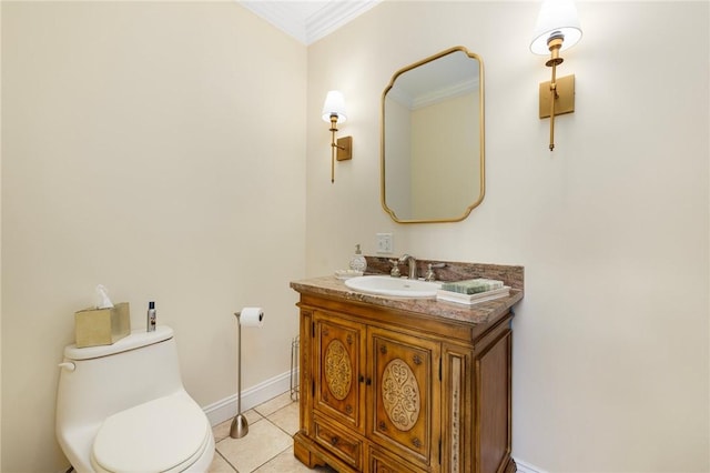 bathroom with tile patterned floors, vanity, toilet, and ornamental molding