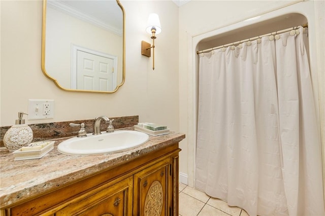 bathroom featuring tile patterned floors, vanity, and ornamental molding