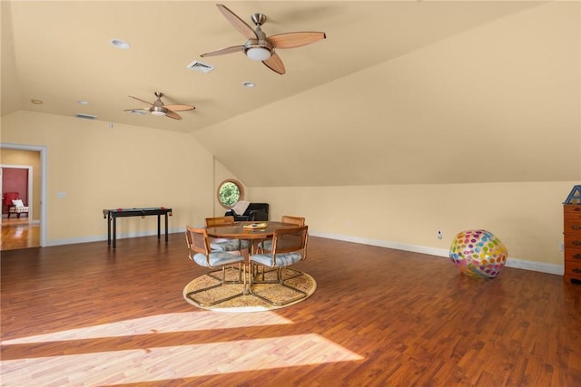 playroom featuring dark hardwood / wood-style flooring, ceiling fan, and lofted ceiling