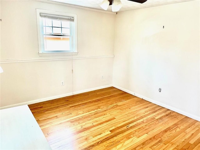 unfurnished room with ceiling fan and light hardwood / wood-style flooring