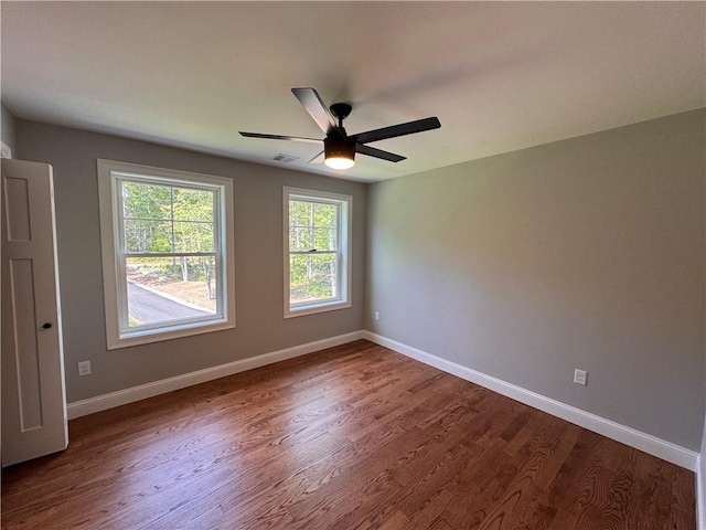 empty room featuring ceiling fan and wood-type flooring