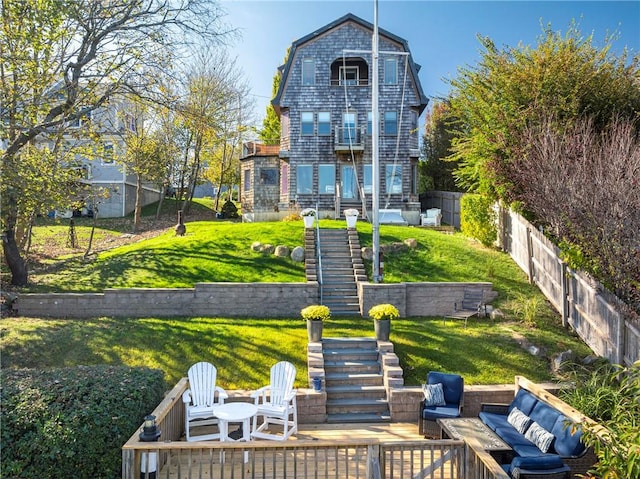 rear view of house featuring a yard