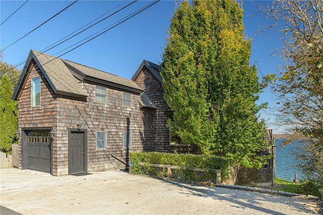 view of property exterior with a garage