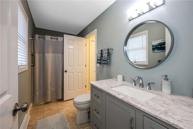 bathroom featuring tile patterned flooring, vanity, toilet, and a shower with shower curtain