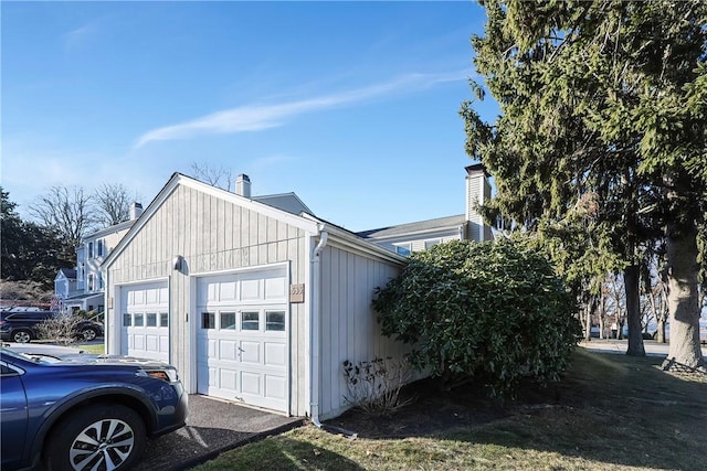 view of side of home featuring a garage