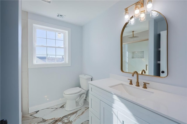 bathroom with vanity, toilet, and walk in shower