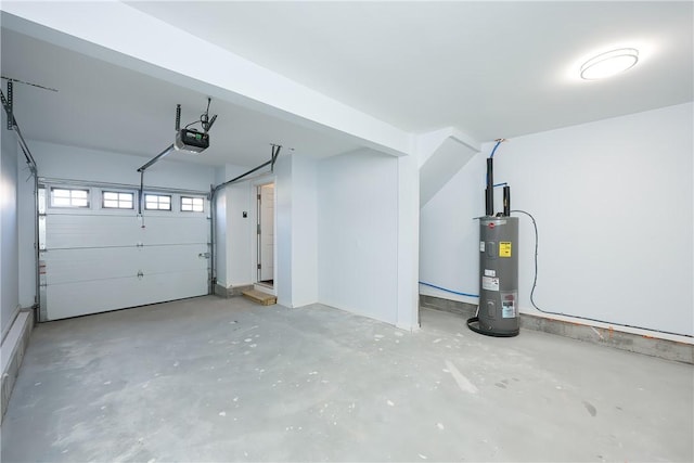 garage with electric water heater and a garage door opener