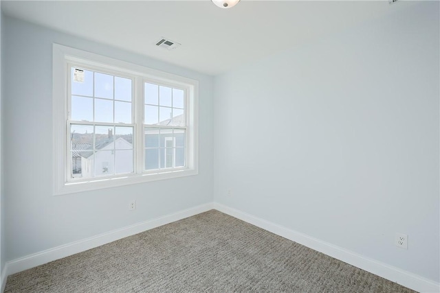 unfurnished room featuring carpet flooring